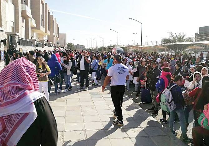 Filipino workers trying to get amnesty are seen waiting outside the Philippine Embassy in Kuwait City in this file picture. — Courtesy photo