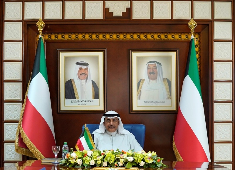 Kuwait’s Prime Minister Sabah Khaled Al-Hamad Al-Sabah is seen chairing a virtual Cabinet meeting to discuss measures to address the effects of coronavirus. — KUNA photo