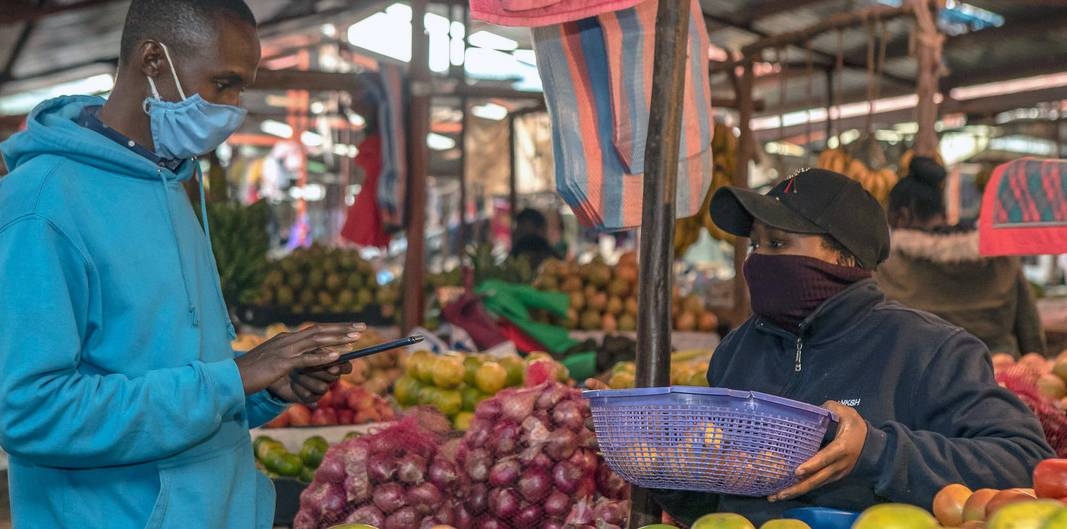 A man in Kenya shops for produce as the coronavirus pandemic brings into focus the interdependence between humanity and biodiversity. — courtesy World Bank / Sambrian Mbaabu