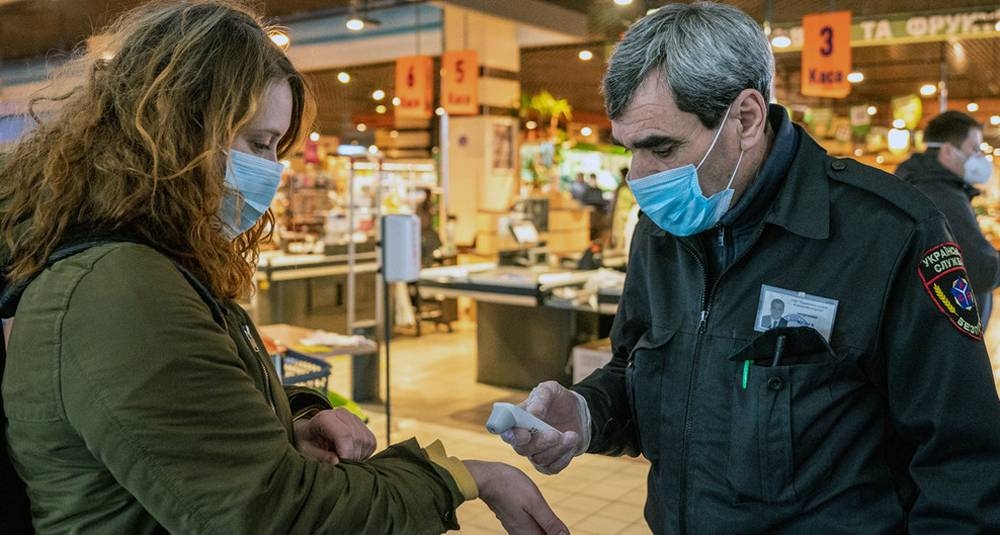

Shoppers are checked for fever at the entrance to shops. Wearing masks inside a store is mandatory in Keiv, Ukraine. — courtesy UN Ukraine/Volodymyr Shuvayev