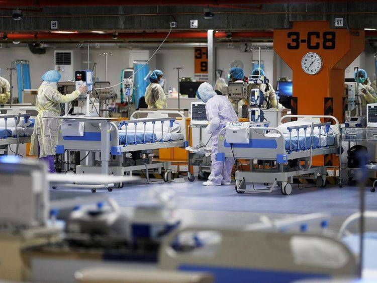 Doctors and nurses are seen doing their final check on the equipment in a makeshift ICU 