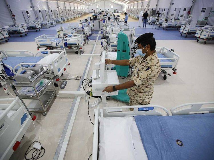 A Bahrain Defense Force medical personnel works at a makeshift ICU 