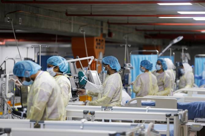 Medics are seen doing their final check on the equipment in a makeshift ICU 