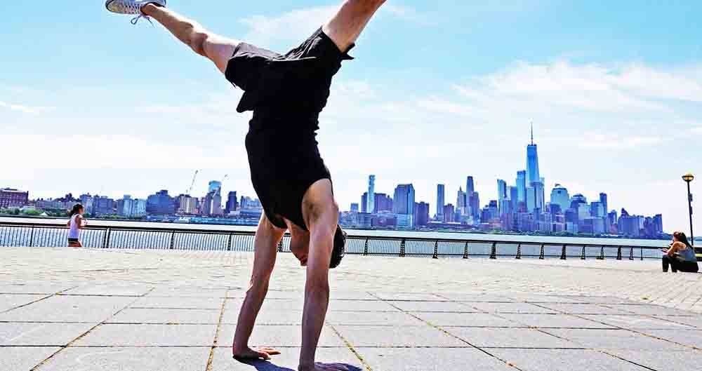 Jon Witt, a yoga teacher, practicing therapeutic yoga postures in Jersey City, USA. — courtesy Winnie Witt