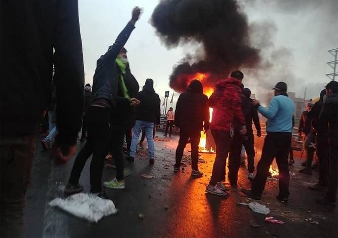 Protesters gather around a fire during a demonstration against an increase in gasoline prices in the capital Tehran, on Nov. 16, 2019. — File photo
