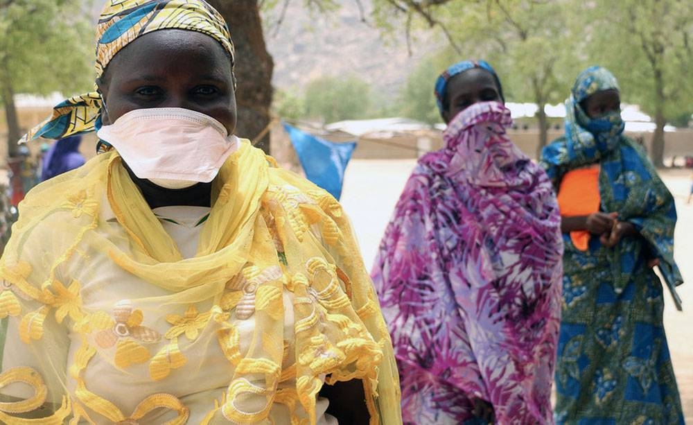 Women queuing for food rations in Cameroon practice social distancing to help combat the spread of COVID-19. — courtesy WFP/Glory Ndaka