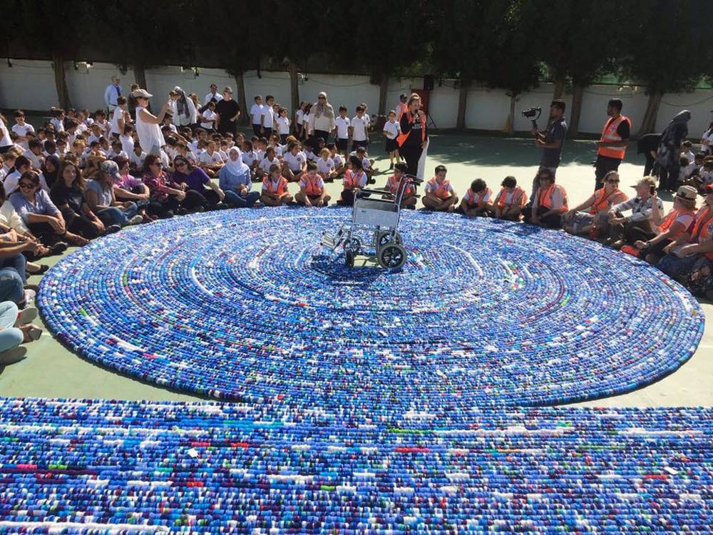 BISJ has created the world’s longest chain of bottle caps by threading 323,103 bottle caps together.