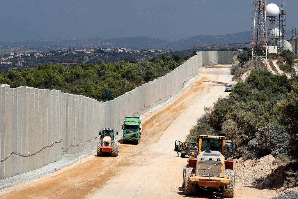 Tractors are seen along a new wall on the Israeli-Lebanese border near the Rosh Hanikra border crossing. — File photo
