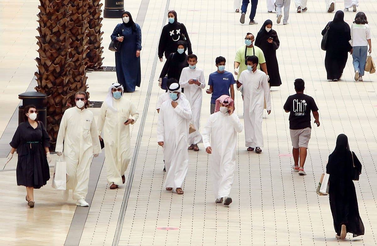 Kuwaitis wearing face masks walk inside the re-opened Avenues Mall in Kuwait City. — Courtesy photo
