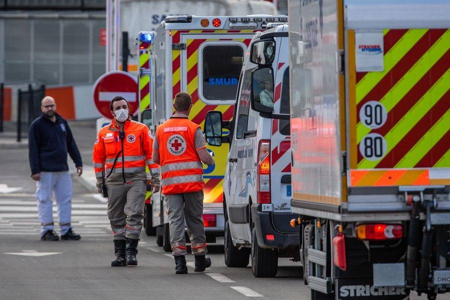 Medical staff and ambulances arrive at the Orly Airport in Paris, from where the coronavirus patients were transferred by military helicopters to southern France to receive treatment. — File photo
