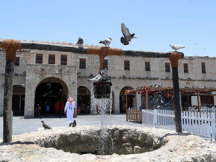 Pigeons linger around a fountain at Qatar's touristic Souq Waqif in the capital Doha. — Courtesy photo
