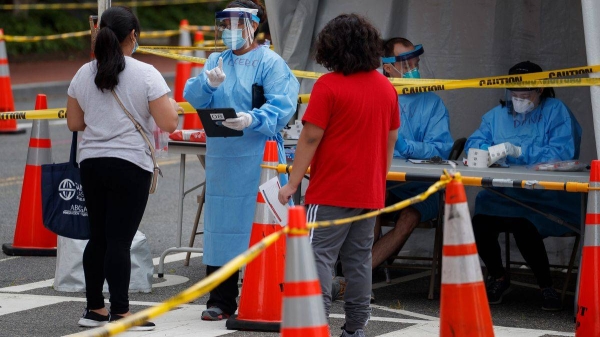 Medical personnel and volunteers assist people in line for free public COVID-19 testing at Judiciary Square in Washington. — Courtesy photo
