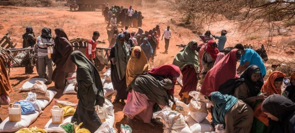 In the western desert town of Dinsoor, Somalia, newly arrived drought victims receive food supplies delivered by the UN's World Food Program. — File photo