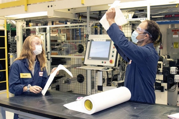 3M is collaborating with the lab of MIT Associate Professor Hadley Sikes to jointly develop a rapid COVID-19 test. Here, 3M COVID-19 test team members work in a pilot lab facility. — courtesy photo (3M)