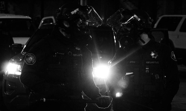 Policemen at the Black Lives Matter protest in Portland, Oregon, USA. — courtesy Unsplash/Tito Texidor