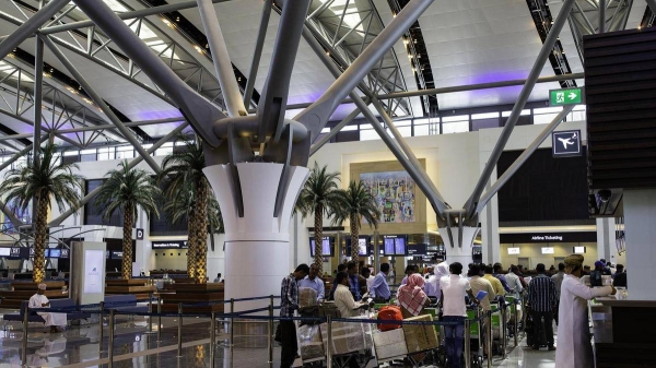 Foreign travelers check in at the Muscat International Airport before leaving the Omani capital. — File photo
