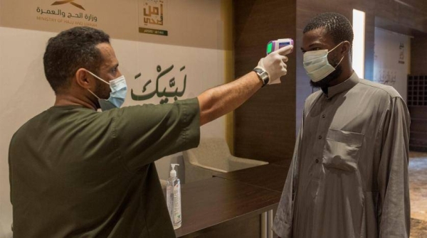 A medic examines a Hajj pilgrims upon his arrival in Makkah. — SPA
