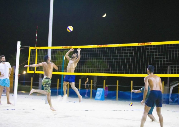 Action during the Esperia Beach Volleyball Tournamentat at Kite Beach on Saturday night.