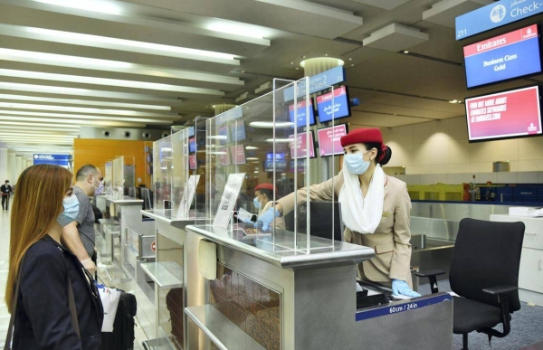 A tourist at the immigration counter of Teminal 3 at Dubai airport. — File photo
