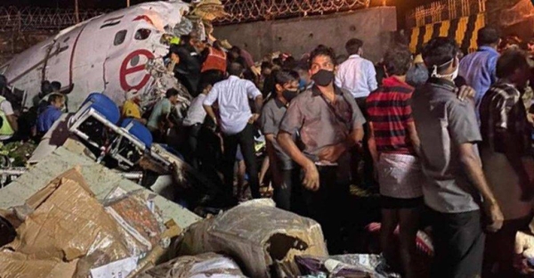 Local people engage in rescue mission at the site of the plane crash in Kozhikode.