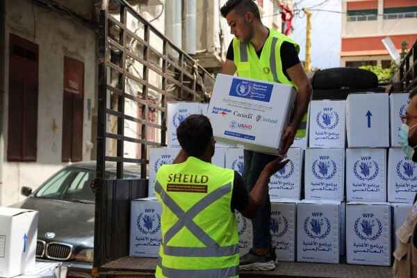 Workers unload WFP food aid at the Karageusian Center in Beirut, Lebanon. — courtesy  WFP/Ziad Rizkallah
