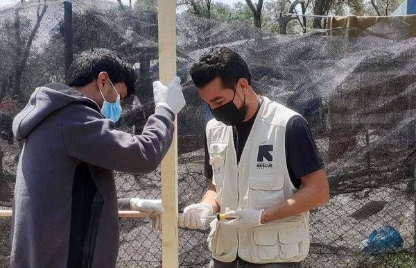 Shadi Mohammedali, a refugee from Gaza, now works for the International Rescue Committee (IRC). Here he is pictured in the Moria Refugee Camp in Greece. — courtesy IRC
