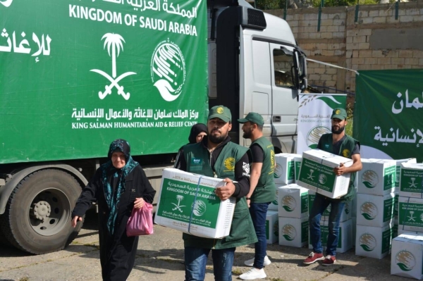 King Salman Humanitarian Aid and Relief Center workers distributing Ramadan food baskets among Palestinian refugee families in Beirut. — File photo