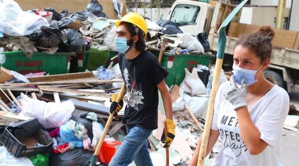 Community supporters clean up the aftermath of the catastrophic explosion in the area of Gemmayze, in Beirut, Lebanon. — courtesy UNICEF/Ramzi Haidar