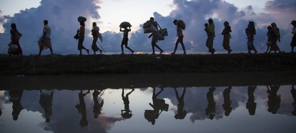 Rohingya refugees cross the border near Anzuman Para village, Palong Khali, Bangladesh, in this 2017 file photo. — Courtesy photo 
