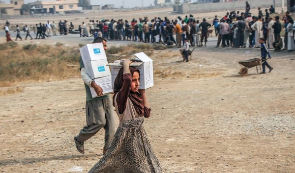 Humanitarian partners distribute emergency assistance in Ibrahim Khalil village in Iraq. — courtesy OCHA/Themba Linden