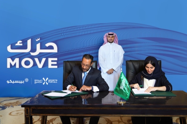 SFA Managing Director Shaima Saleh Al-Husseini and Tamer Mosalam, Gulf & Levant Foods Vice President and Business Unit General Manager at PepsiCo, signing a partnership deal on Sunday. — Courtesy photo