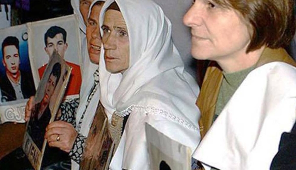 File photo shows relatives of the missing demonstrating silently outside UN headquarters in Pristina, Kosovo, 2002. — courtesy UN Photo