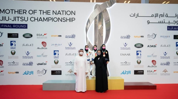 Noura Al Kaabi, minister of culture and youth, and Mohammed Salem Al Dhaheri, vice president of the UAE Jiu-Jitsu Federation awarding the winners.