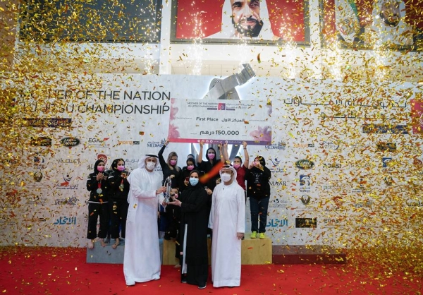 Noura Al Kaabi, minister of culture and youth, and Mohammed Salem Al Dhaheri, vice president of the UAE Jiu-Jitsu Federation awarding the winners.