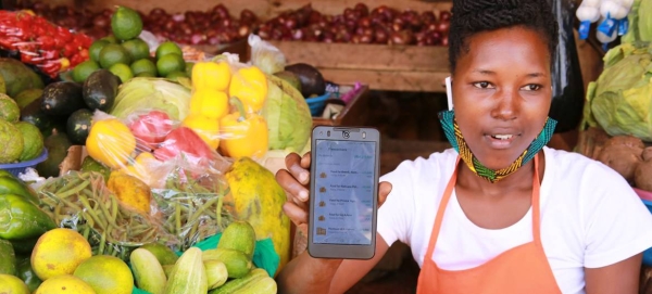 A market vendor uses the SafeBoda app which connects vendors to households using the SafeBoda transport service during the COVID-19 lockdown in Kampala, Uganda. — Courtesy photo
