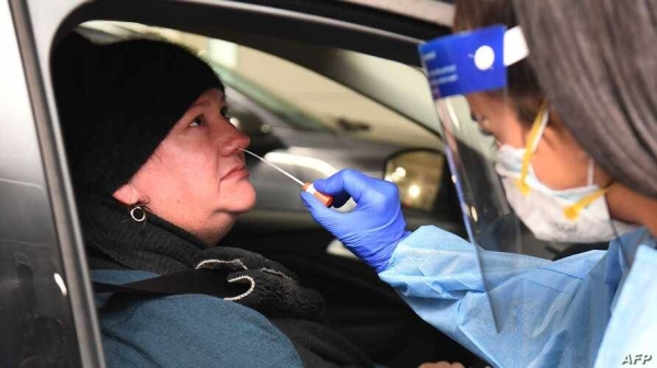 Medical staff perform a test for COVID-19 on a driver at a drive-through testing site in Melbourne, Australia. — File photo
