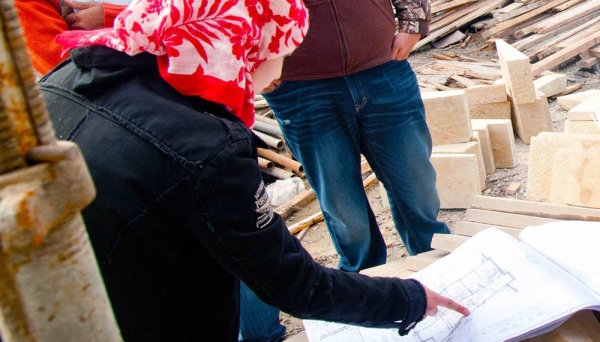 A female engineer checks on a construction site in Amman, Jordan. — courtesy ILO/Jared J. Kohler