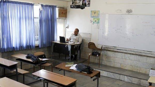 A teacher takes online school classes in Iran. — Courtesy photo
