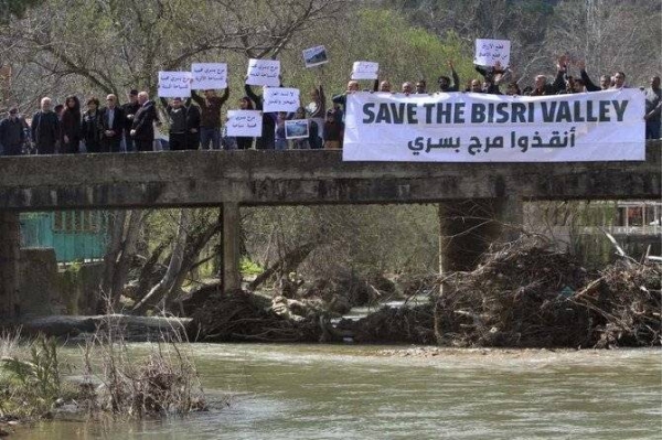 Protesters hold placards during a protest against the Bisri dam project in the Bisri Valley, 58 km southeast of Beirut, in this file photo. — Courtesy photo