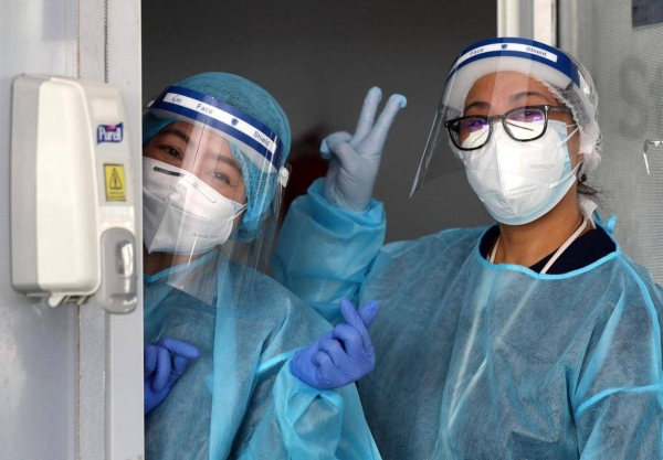 Medical staff at Dubai's Mina Rashid drive-through testing center. — Courtesy photo
