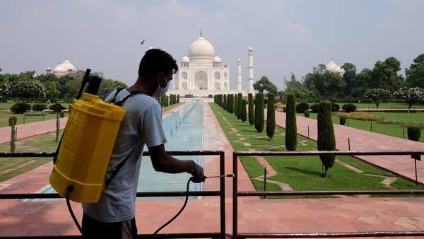 A worker sanitizes railings in the premises of Taj Mahal in Agra, India. — Courtesy photo
