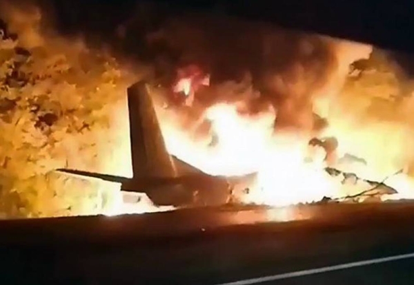 In this TV grab released by Ukraine's Emergency Situation Ministry, an AN-26 military plane bursts into flames after it crashed in the town of Chuhuyiv, Ukraine on Friday. — courtesy Emergency Situation