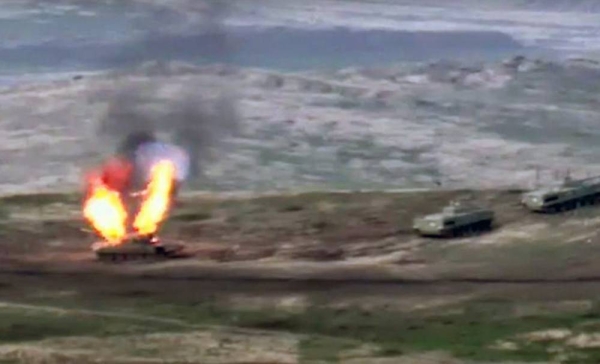 A photo released by the Armenian defense ministry appears to show an Azerbaijani tank being destroyed on Sept. 27, 2020.