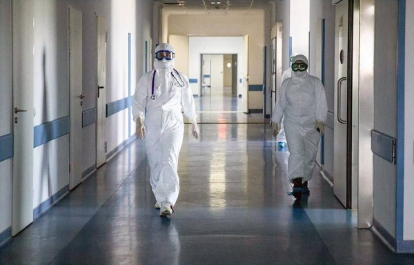 FIle photo shows Medical staff members walk in a hallway in an intensive care unit for COVID-19 patients at Ependiyev Republican Clinical Hospital. Russia reported 9,859 new coronavirus, COVID-19, cases on Saturday, the highest number of daily infections since May 15, when the outbreak was at its peak. — courtesy TASS