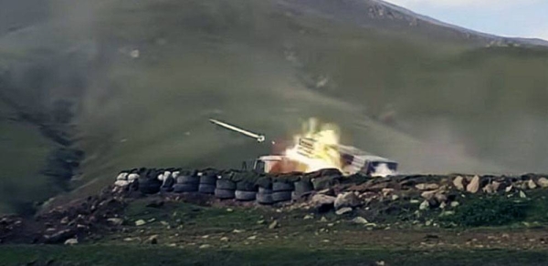 In this screen grab taken from video released by Azerbaijan's Defense Ministry on Saturday, an Azerbaijan's army's multiple rocket launcher fires.