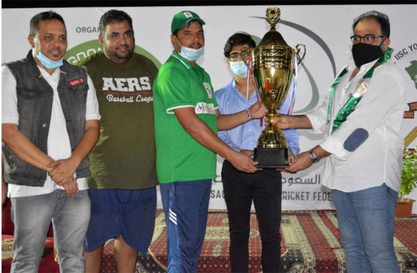 Al Burj Usman receiving CSG Sixes 90th Saudi National Day Cup from Mohammed Amer Khan of SACF and Mohammed Uzair of CSG.