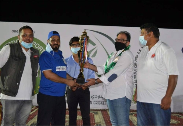 Al Burj Usman receiving CSG Sixes 90th Saudi National Day Cup from Mohammed Amer Khan of SACF and Mohammed Uzair of CSG.