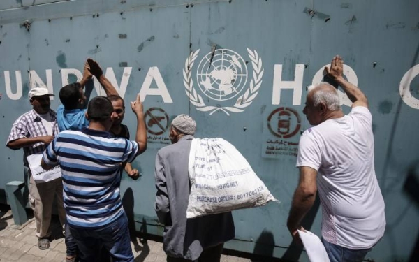 Employees of the UN Relief and Works Agency for Palestine Refugees in the Near East (UNRWA) and their families protest against job cuts announced by the agency outside its offices in Gaza City in this July 31, 2018 file picture.