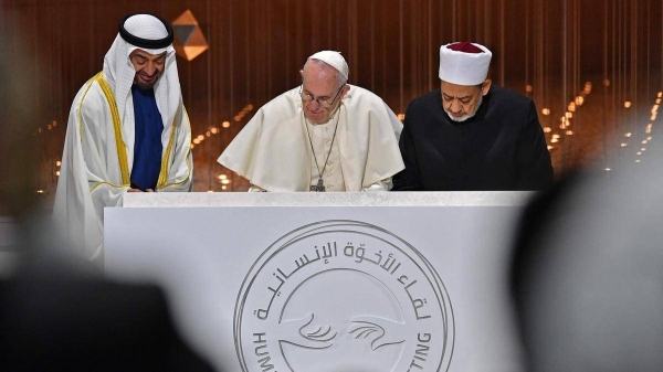 Abu Dhabi Crown Prince Sheikh Mohamed bin Zayed, left, Pope Francis, center, and Sheikh Ahmed Al Tayeb, Grand Imam of Al Azhar, sign the Document of Human Fraternity in this February 2019 file photo. — Courtesy photo