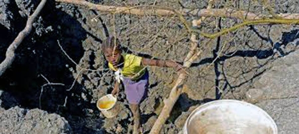 A 10-year-old child helps her family look for water in southern Angola. Failed rains in the first three months of 2019 decimated crops and livestock, affecting about 2.3 million people. — courtesy UNICEF/Louzada